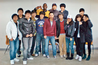 Frank Barr ’01(second row, left) with his students at Woosong University in South Korea. He played professional basketball with teams in Dubai, New Zealand, Switzerland, Saudi Arabia, Lebanon, and Bahrain.