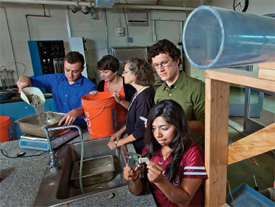 Brian Skalla ’16 (L-R), Hailey Votta '15, Prof. Laurie Caslake, Prof. Michael McGuire, and Erika Hernandez '17 work together in Acopian Engineering Center using the dust-measuring apparatus designed by Skalla and Hernandez.