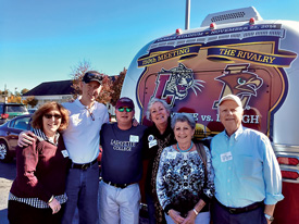Beth (L–R) and James Maguire P’14, Michael and Jenny Weisburger ’82, Bobby and Mark Weisburger ’55 outside Atlanta