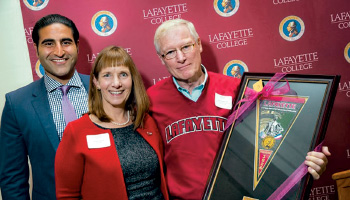 Alex Karapetian ’04 (left) and President Alison Byerly congratulate award recipient Ray Moyer ’63