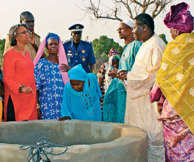 Villagers in Fadiga, Senegal, explain how they are using a new well provided by U.S. government funds.