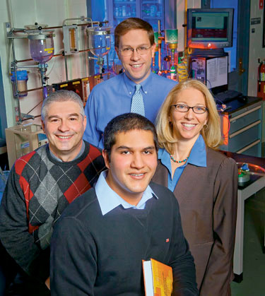Asad Akram ’13 (center) with his mentors (L-R) Tom DeFazio, coordinator of chemical and environmental engineering labs; Joshua Levinson, assistant professor of chemical and biomolecular engineering, and Jodie Frey, director of recreation services.