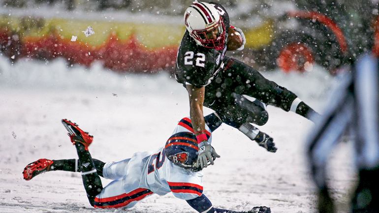 Vaughn Hebron ’13, former Leopard tailback, hurdles over the competition during a snowy October 2011 game.
