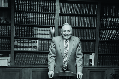 Anthony E. Russo standing in an office in front of bookcases